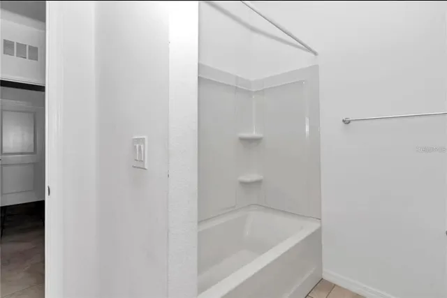 a close view of a bathtub in a bathroom