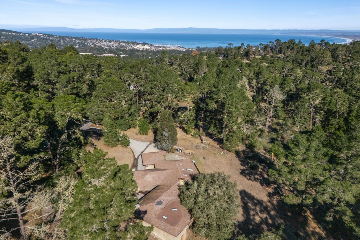 537 Aguajito Road Carmel, CA 93923 - Photo 5 of 7 a view of a city with top of trees