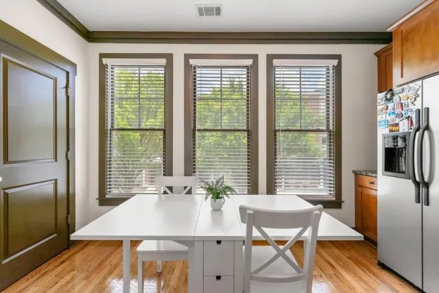 a view of a dining room with furniture window and wooden floor