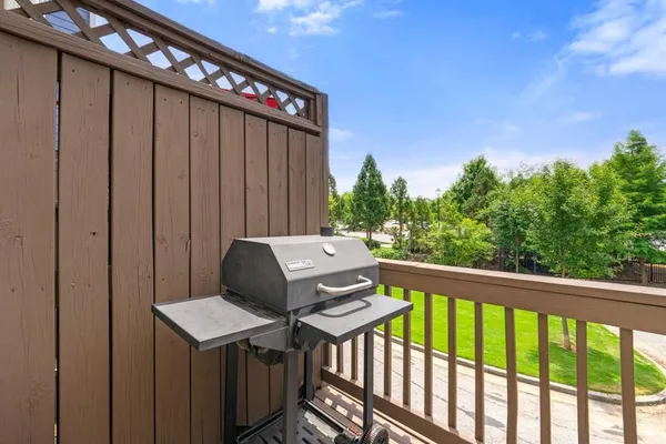 a view of a balcony with wooden floor