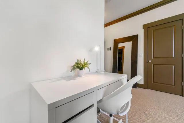 a room with a table and chairs