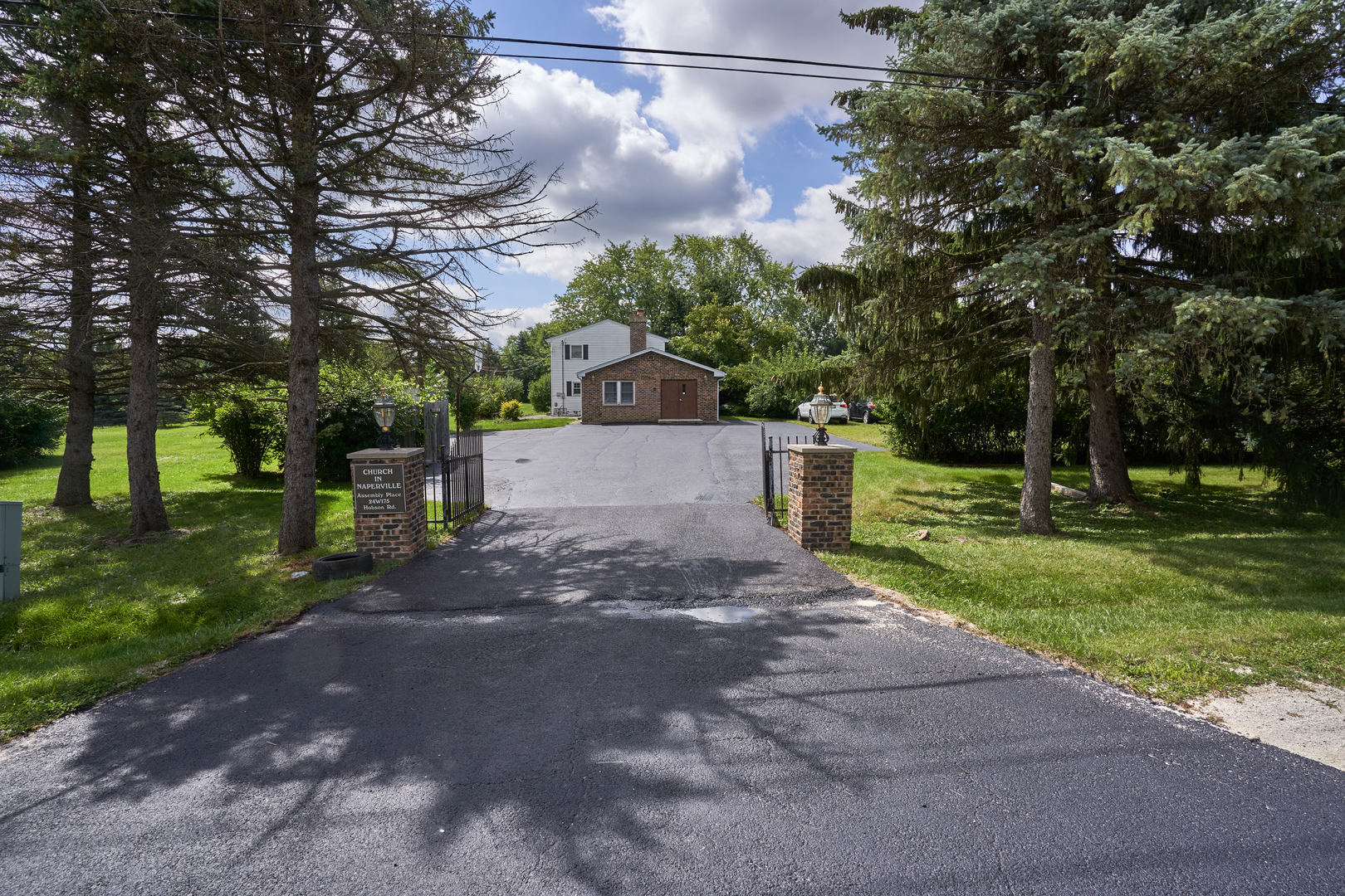 24W175 Hobson Road Naperville, IL 60540 - Photo 1 of 30 a view of a street with a trees park