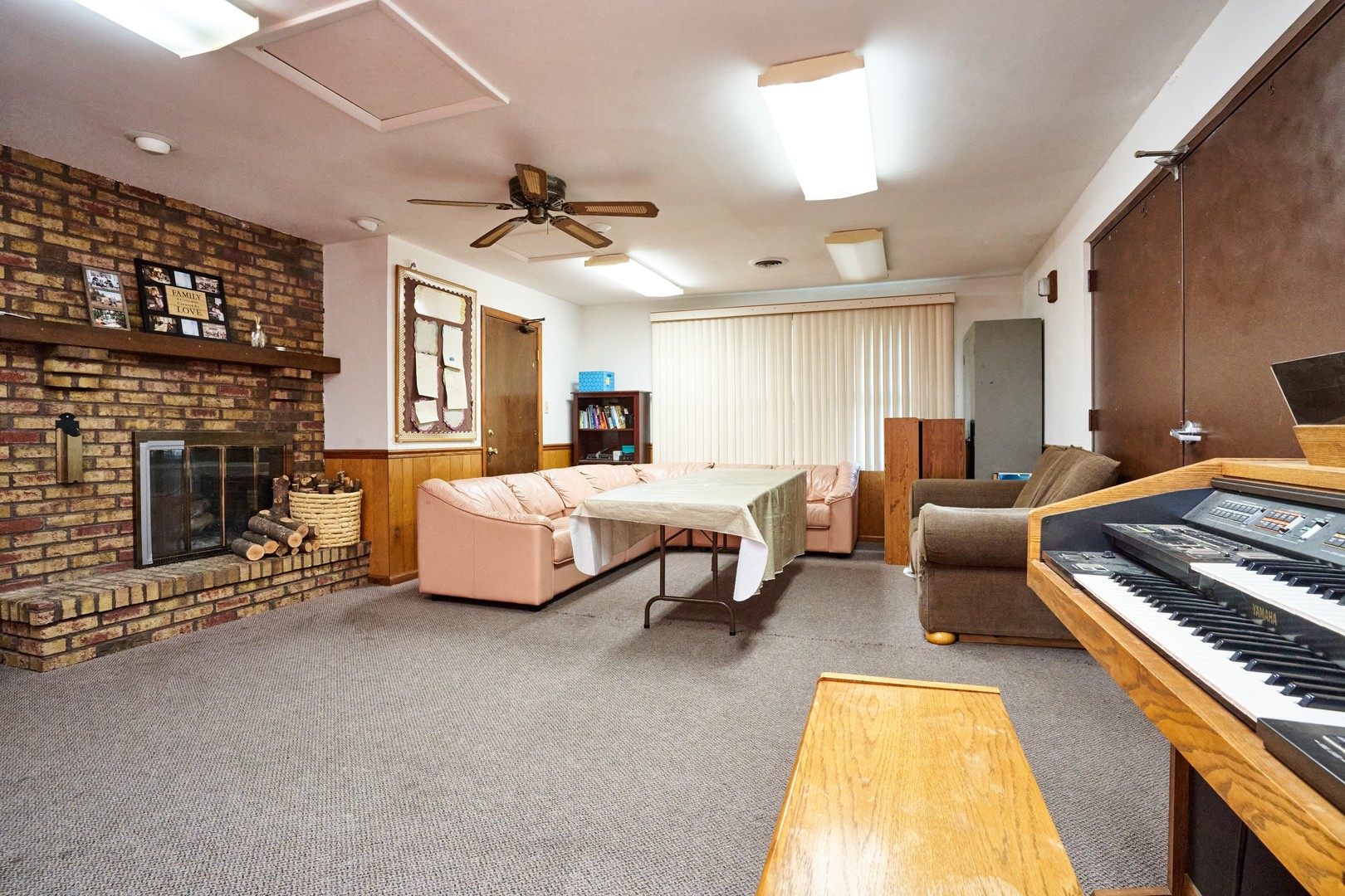 24W175 Hobson Road Naperville, IL 60540 - Photo 11 of 30 a living room with furniture fireplace and a ceiling fan