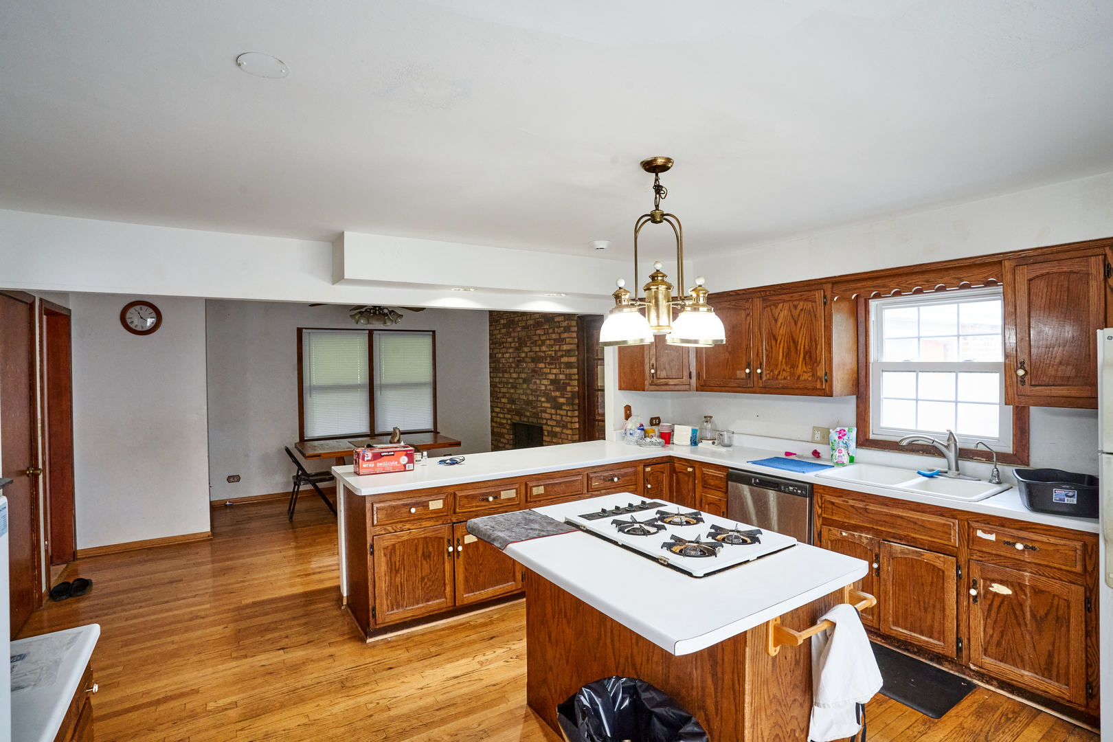 24W175 Hobson Road Naperville, IL 60540 - Photo 13 of 30 a kitchen with a stove and a wooden floor