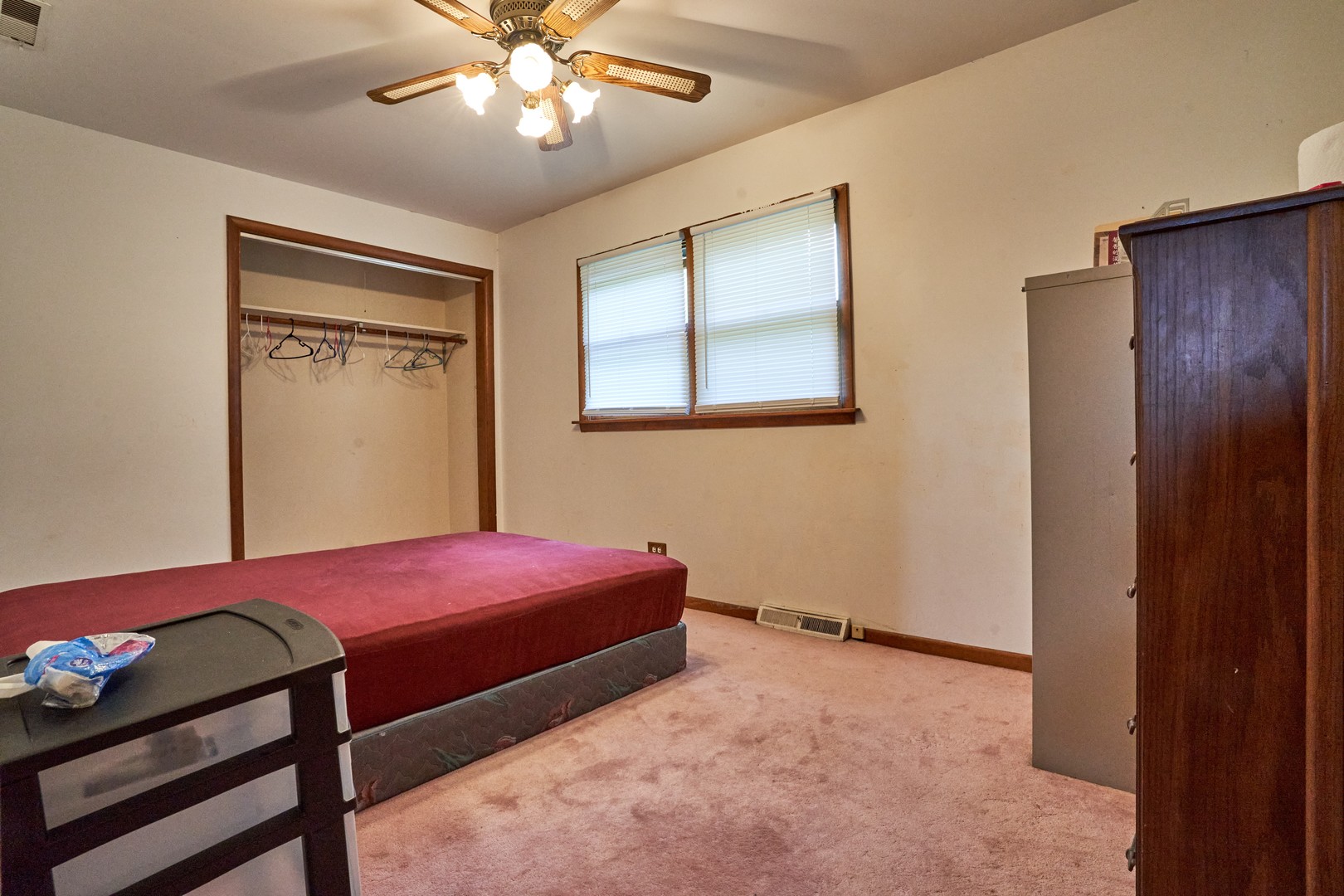 24W175 Hobson Road Naperville, IL 60540 - Photo 16 of 30 a bedroom with a bed and a chandelier