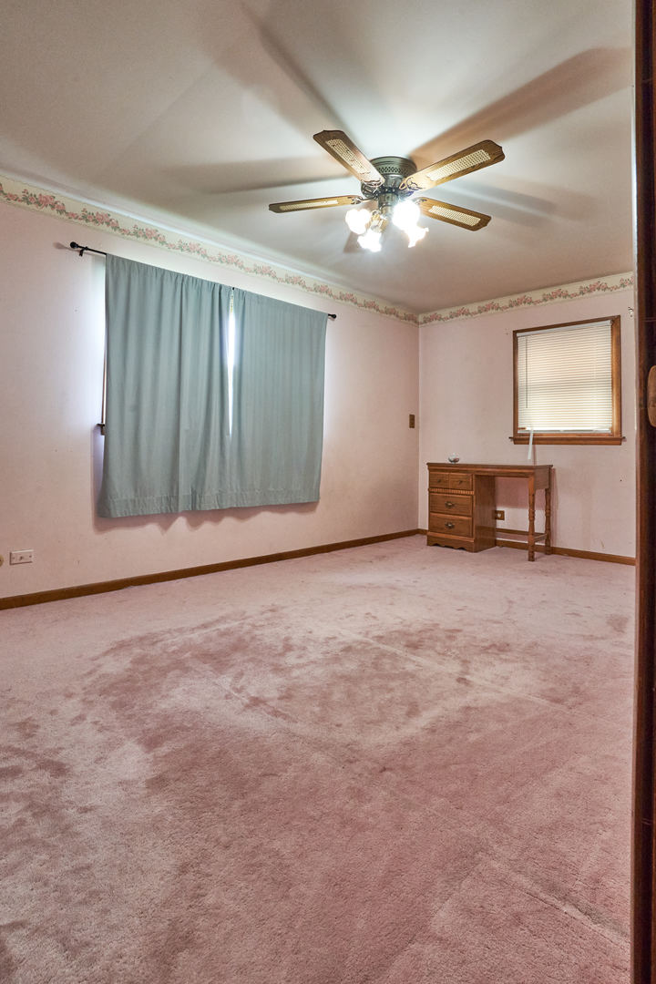24W175 Hobson Road Naperville, IL 60540 - Photo 21 of 30 an empty room with windows and fan