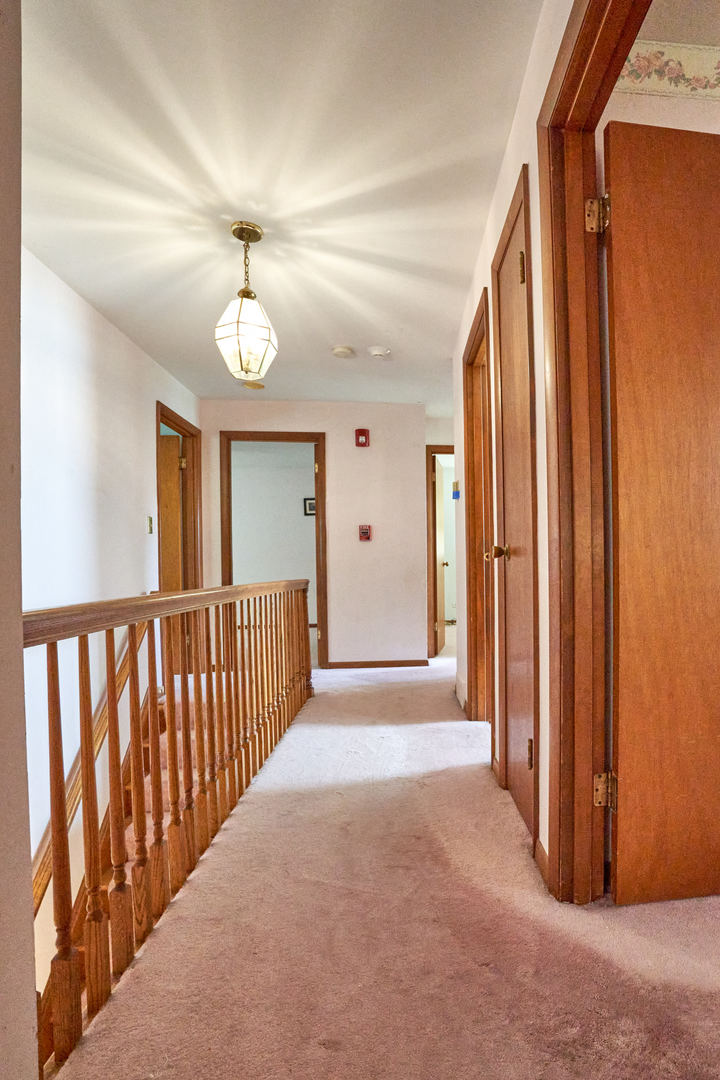 24W175 Hobson Road Naperville, IL 60540 - Photo 24 of 30 a view of a hallway with closet area