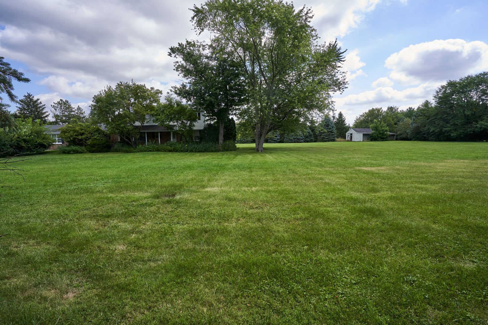 24W175 Hobson Road Naperville, IL 60540 - Photo 8 of 30 a view of field with trees in the background