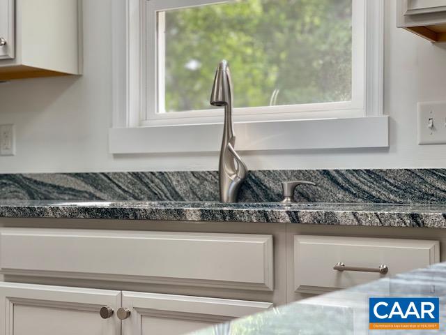 2583 Rio Mills Road Earlysville, VA 22936 - Photo 12 of 41 a close view of a sink a mirror and cabinets