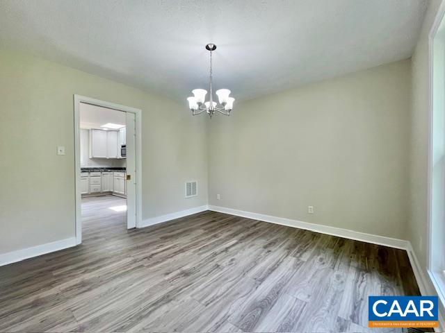 2583 Rio Mills Road Earlysville, VA 22936 - Photo 15 of 41 a view of livingroom with hallway and wooden floor
