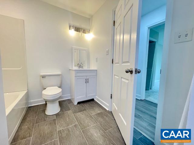 2583 Rio Mills Road Earlysville, VA 22936 - Photo 19 of 41 a bathroom with a toilet a sink and mirror