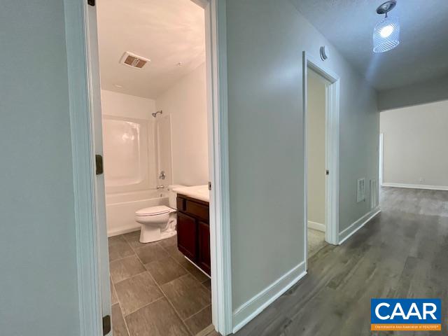 2583 Rio Mills Road Earlysville, VA 22936 - Photo 23 of 41 a view of bathroom with a toilet sink and mirror