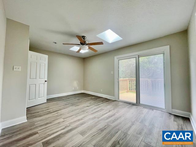 2583 Rio Mills Road Earlysville, VA 22936 - Photo 26 of 41 a view of an empty room with a window and wooden floor