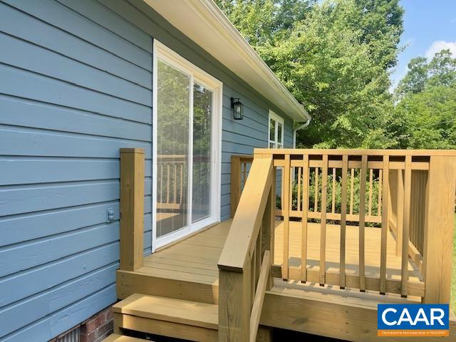 2583 Rio Mills Road Earlysville, VA 22936 - Photo 31 of 41 a view of deck with large trees and wooden stairs