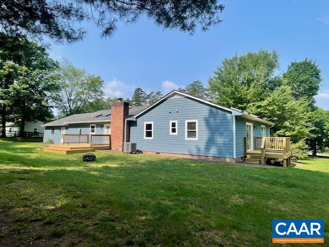 2583 Rio Mills Road Earlysville, VA 22936 - Photo 35 of 41 a view of a yard in front of a house with a large tree