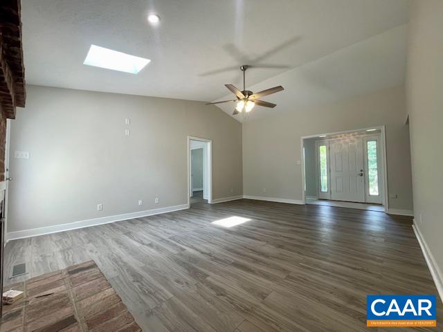 2583 Rio Mills Road Earlysville, VA 22936 - Photo 8 of 41 an empty room with wooden floor and chandelier
