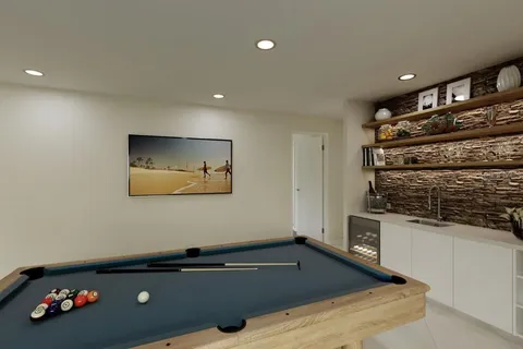 a view of a room with wooden floor