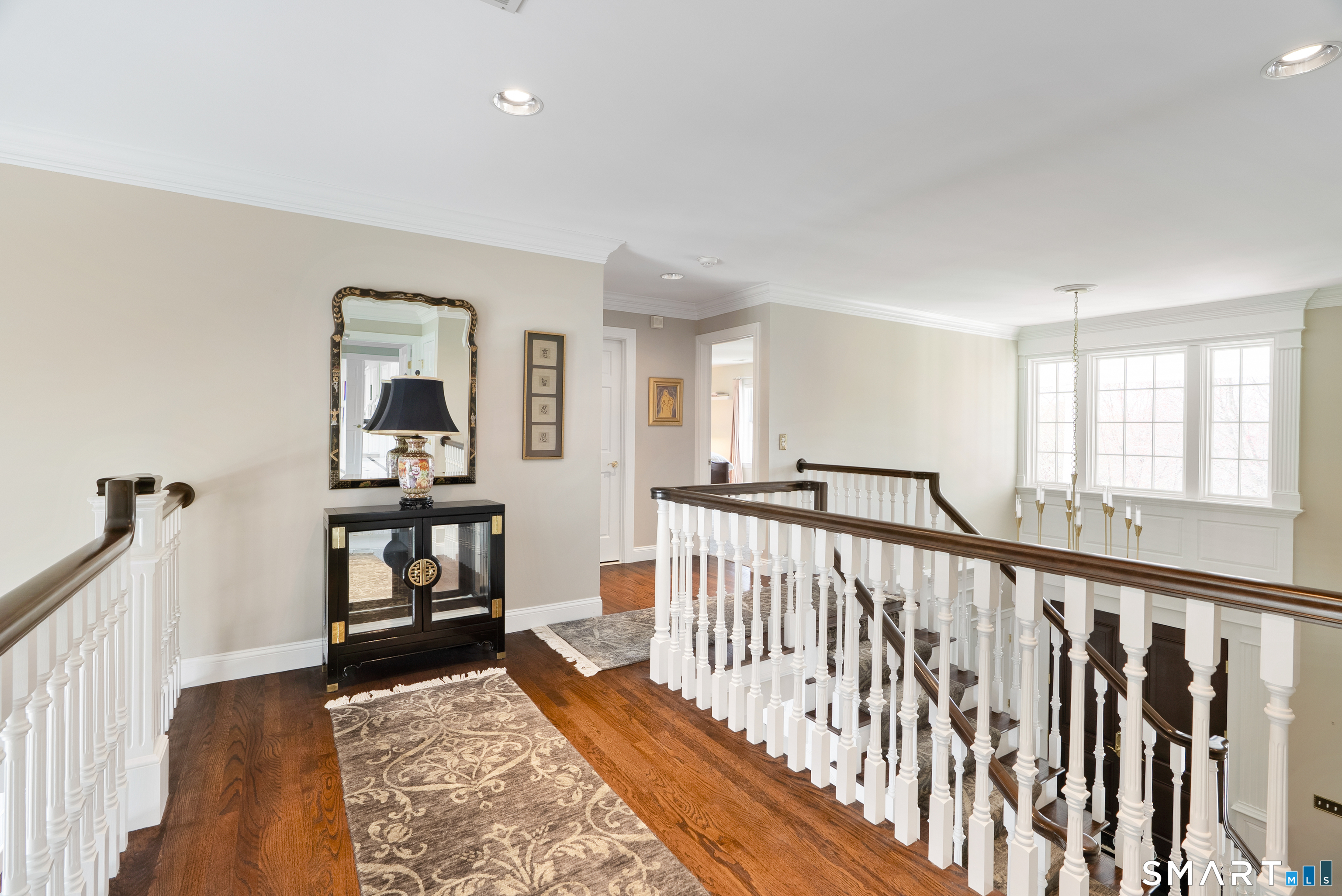 57 Thistledown Suffield, CT 06078 - Photo 17 of 39 a view of staircase with lots of furniture and wooden floor