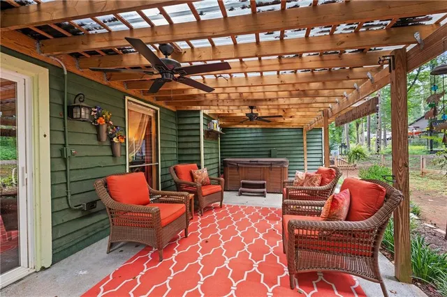 a outdoor living space with patio furniture and a potted plant