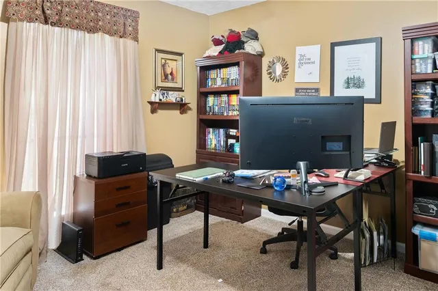 a workspace with furniture and window