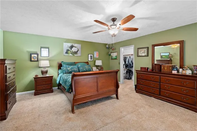 a bed room with a bed and a dresser