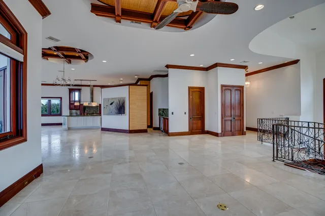 a view of a livingroom with furniture and a gym equipment