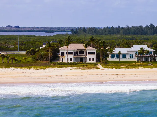 a view of a swimming pool with an ocean view