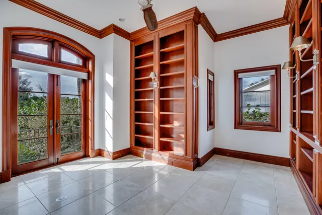 a view of a hallway with wooden floor and entryway