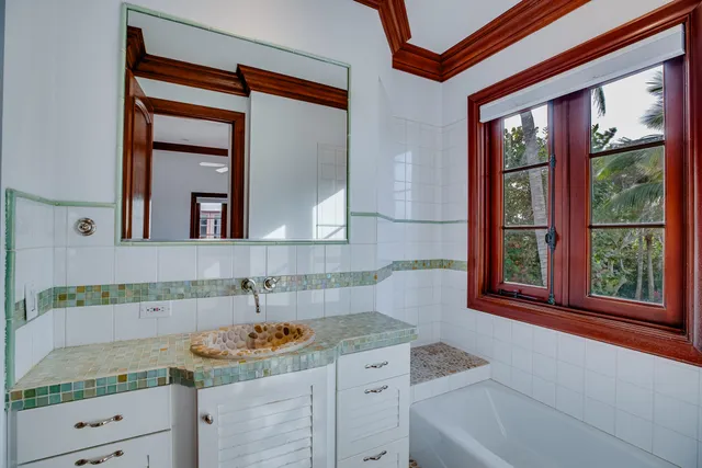 a view of an entryway with wooden floor and door