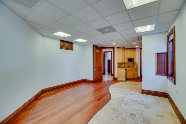 a view of an entryway door with wooden floor