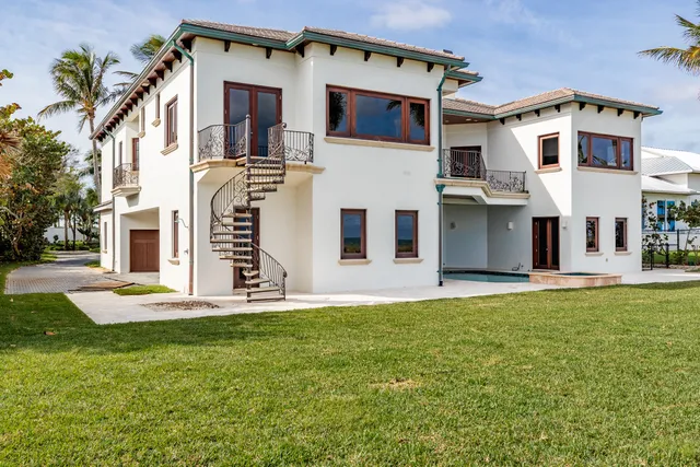 a view of a white house with a large windows