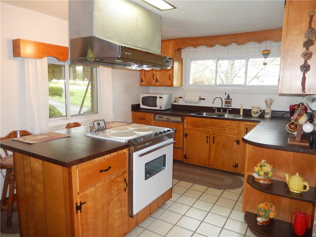 266 Buckeye Road Mount Pleasant, PA 15666 - Photo 7 of 19 Fully equipped kitchen with center island and electric stove and cook top.