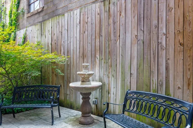 a view of a balcony with chairs