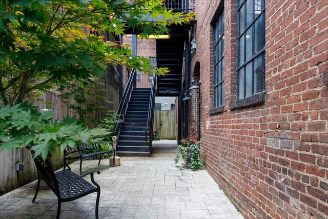 a view of a pathway with a house in the background