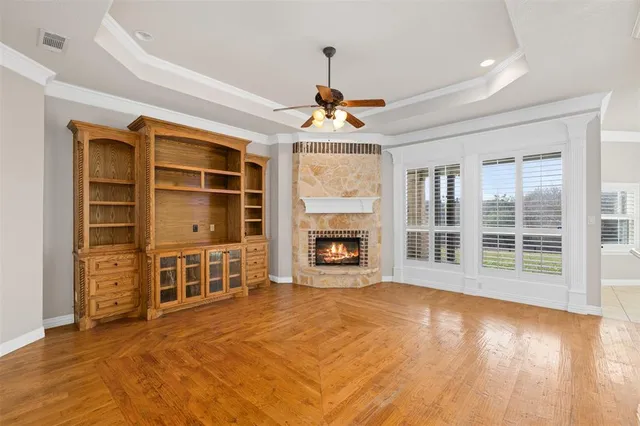 a view of livingroom with furniture fire place and refrigerator