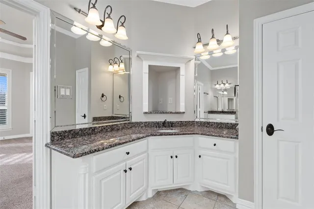 a bathroom with a sink a bathtub a mirror and a shower