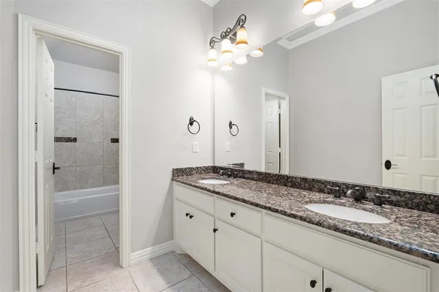 a room with pool table and windows