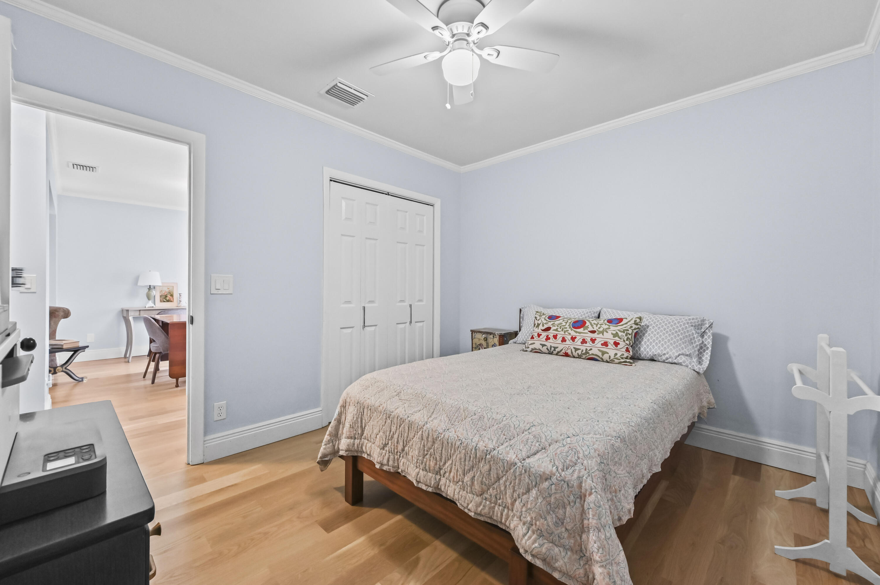 604 Ardmore Road West Palm Beach, FL 33401 - Photo 13 of 15 a bedroom with a bed and a chandelier