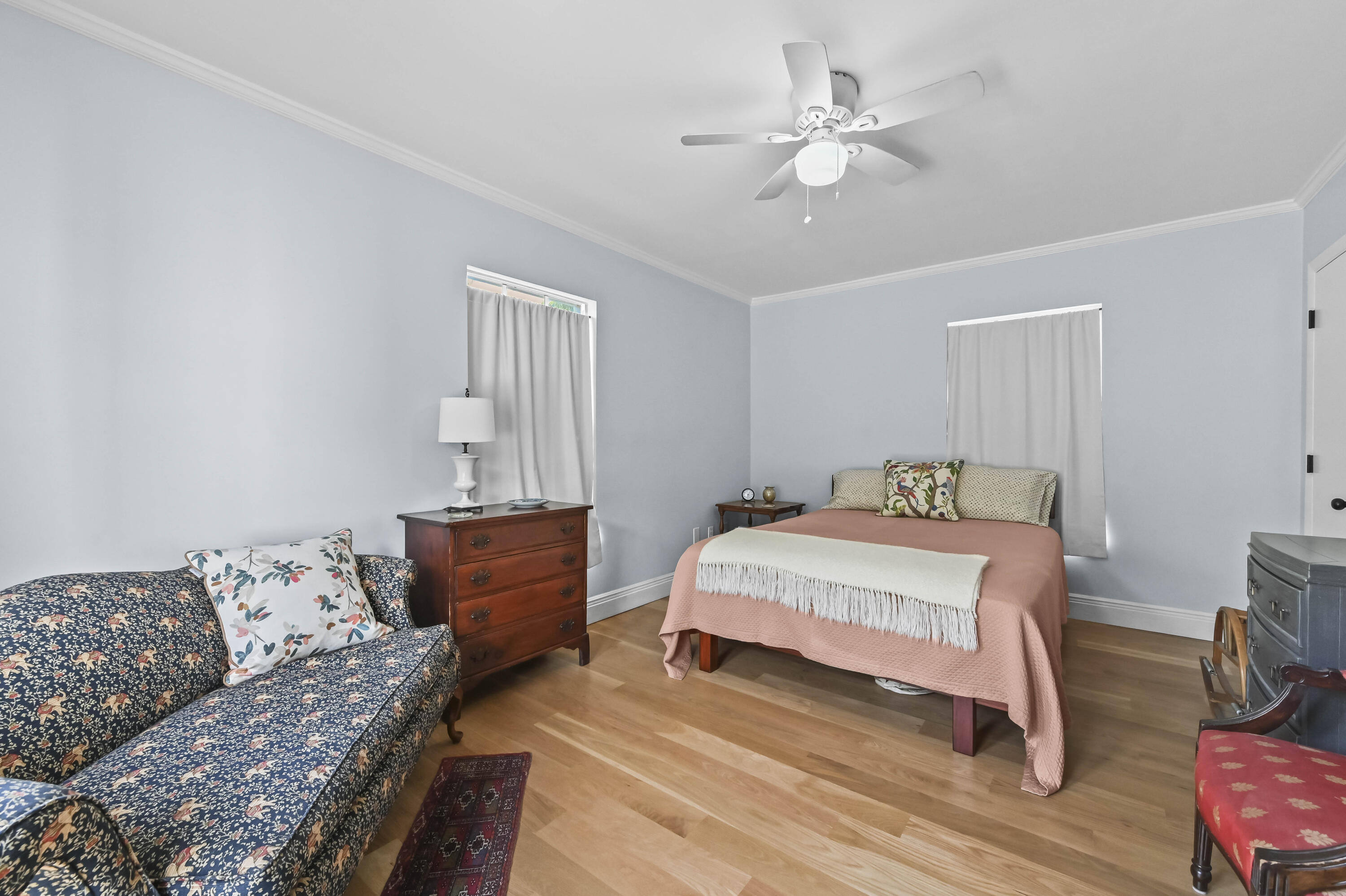 604 Ardmore Road West Palm Beach, FL 33401 - Photo 5 of 15 a bedroom with a bed and a chandelier