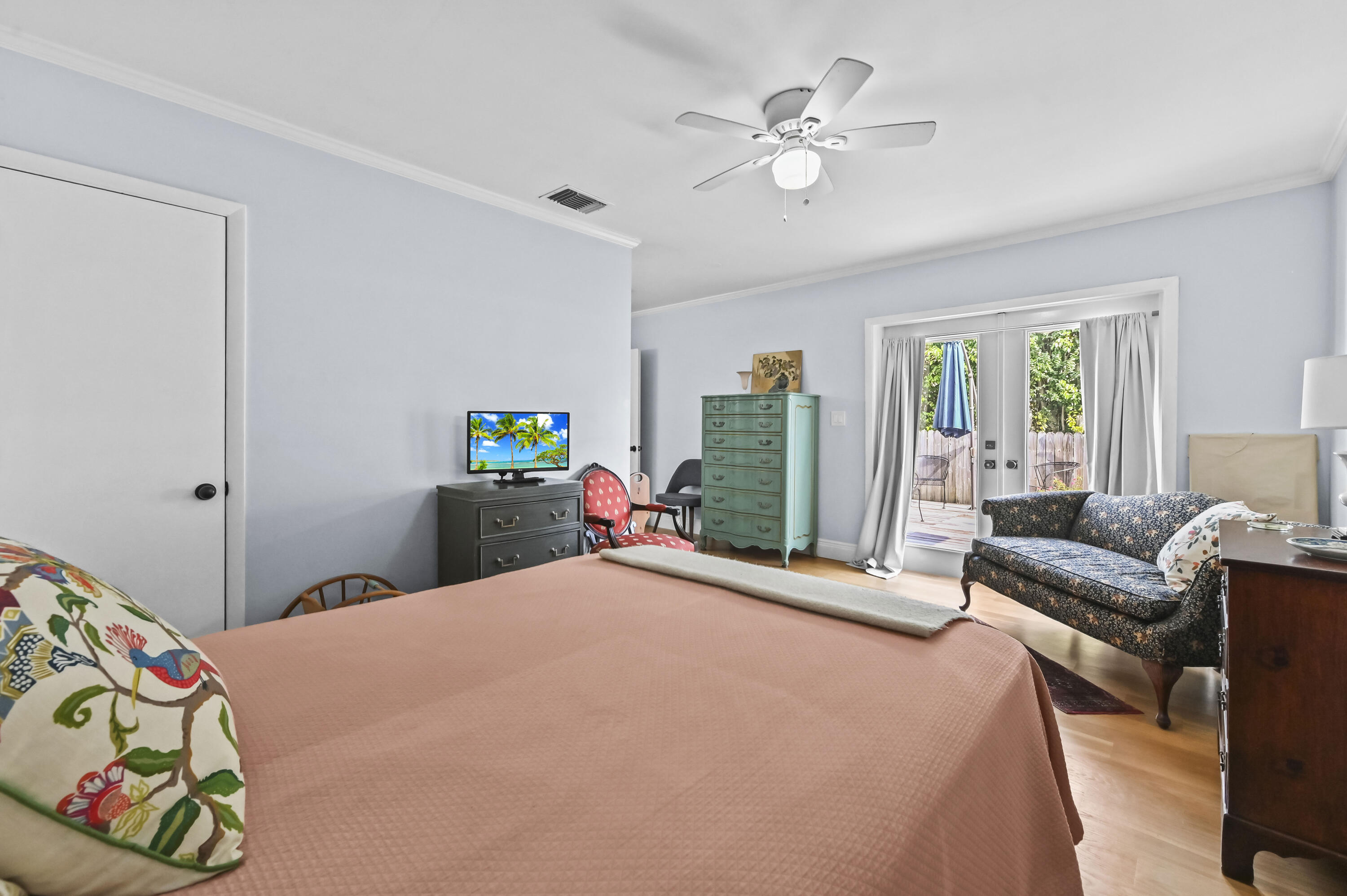 604 Ardmore Road West Palm Beach, FL 33401 - Photo 6 of 15 a bedroom with a bed and a chandelier