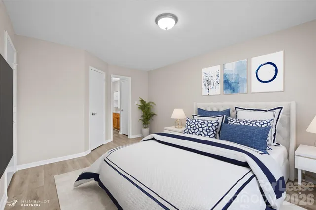 a bedroom with a bed and a table in it