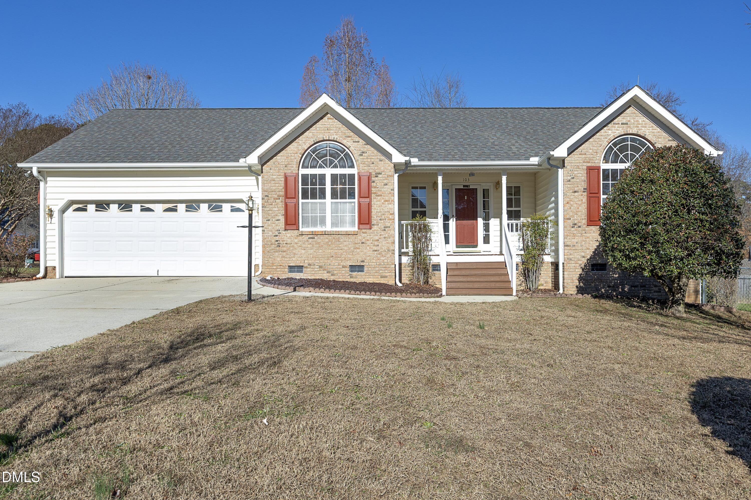 103 Brims Way Garner, NC 27529 - Photo 1 of 36 a front view of a house with a yard