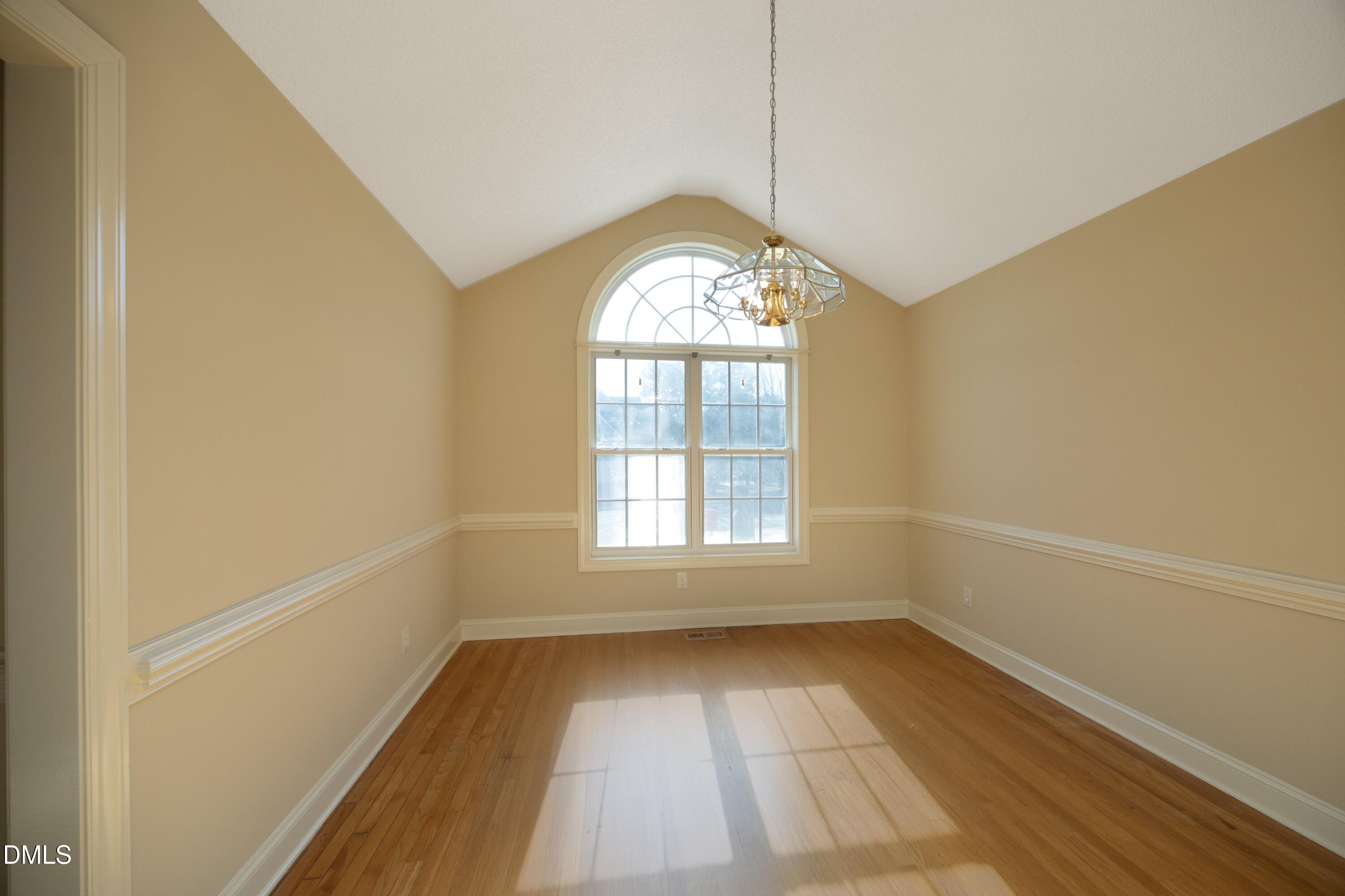 103 Brims Way Garner, NC 27529 - Photo 11 of 36 a view of empty room with wooden floor and fan