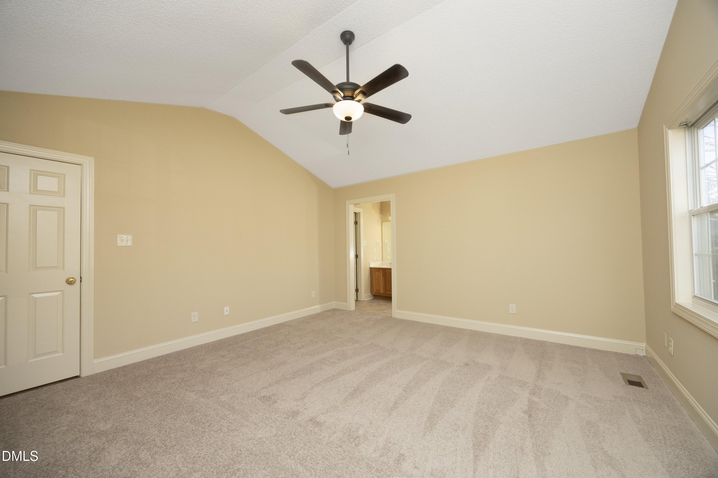 103 Brims Way Garner, NC 27529 - Photo 20 of 36 a view of a room with a ceiling fan and window