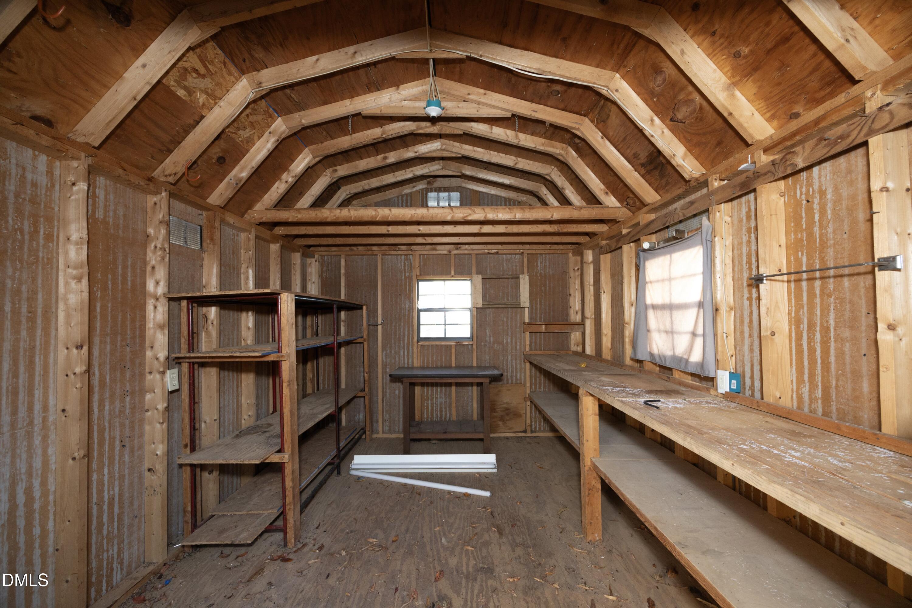 103 Brims Way Garner, NC 27529 - Photo 33 of 36 a view of walk in closet with clothes and shoes
