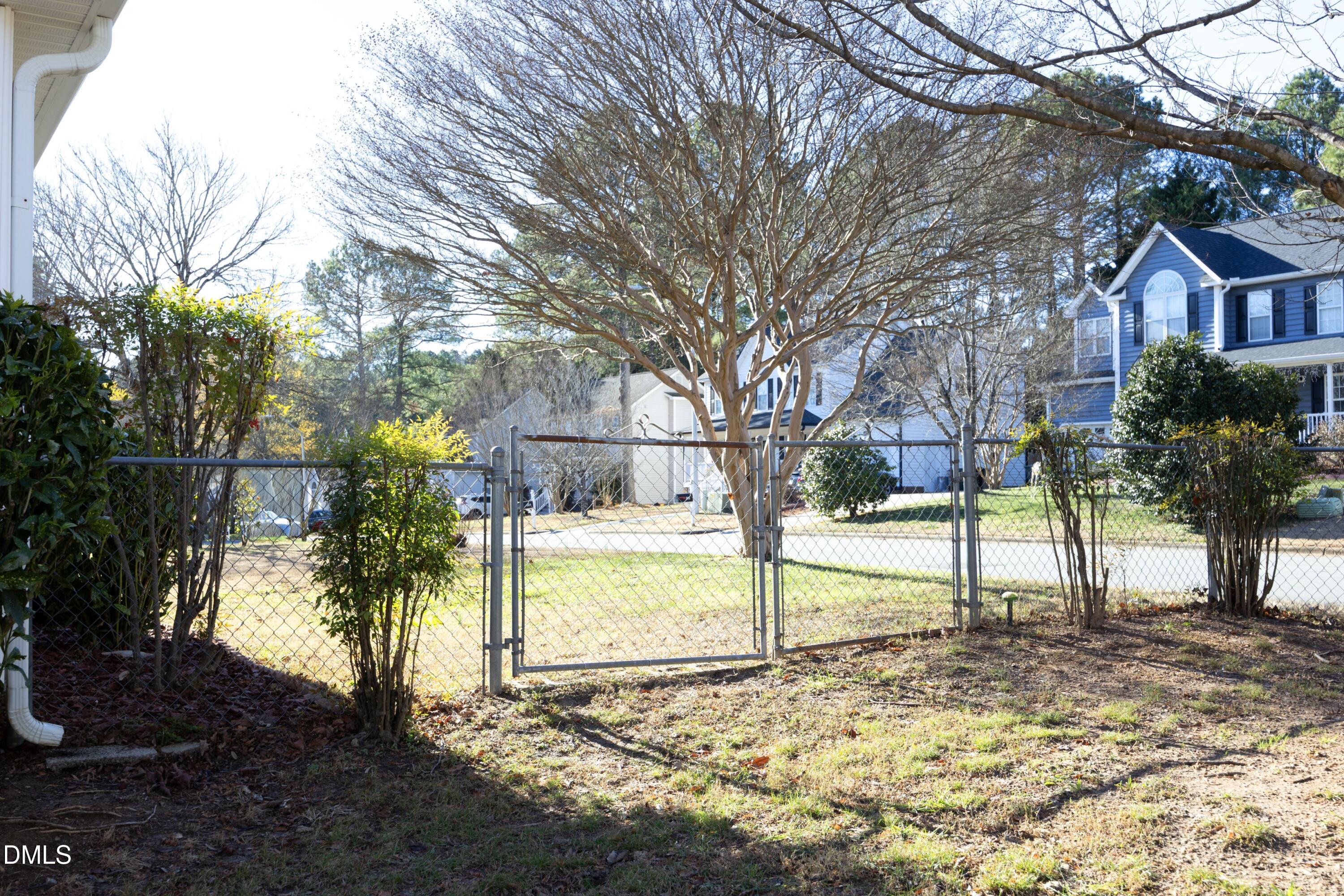103 Brims Way Garner, NC 27529 - Photo 34 of 36 a view of a yard with a tree