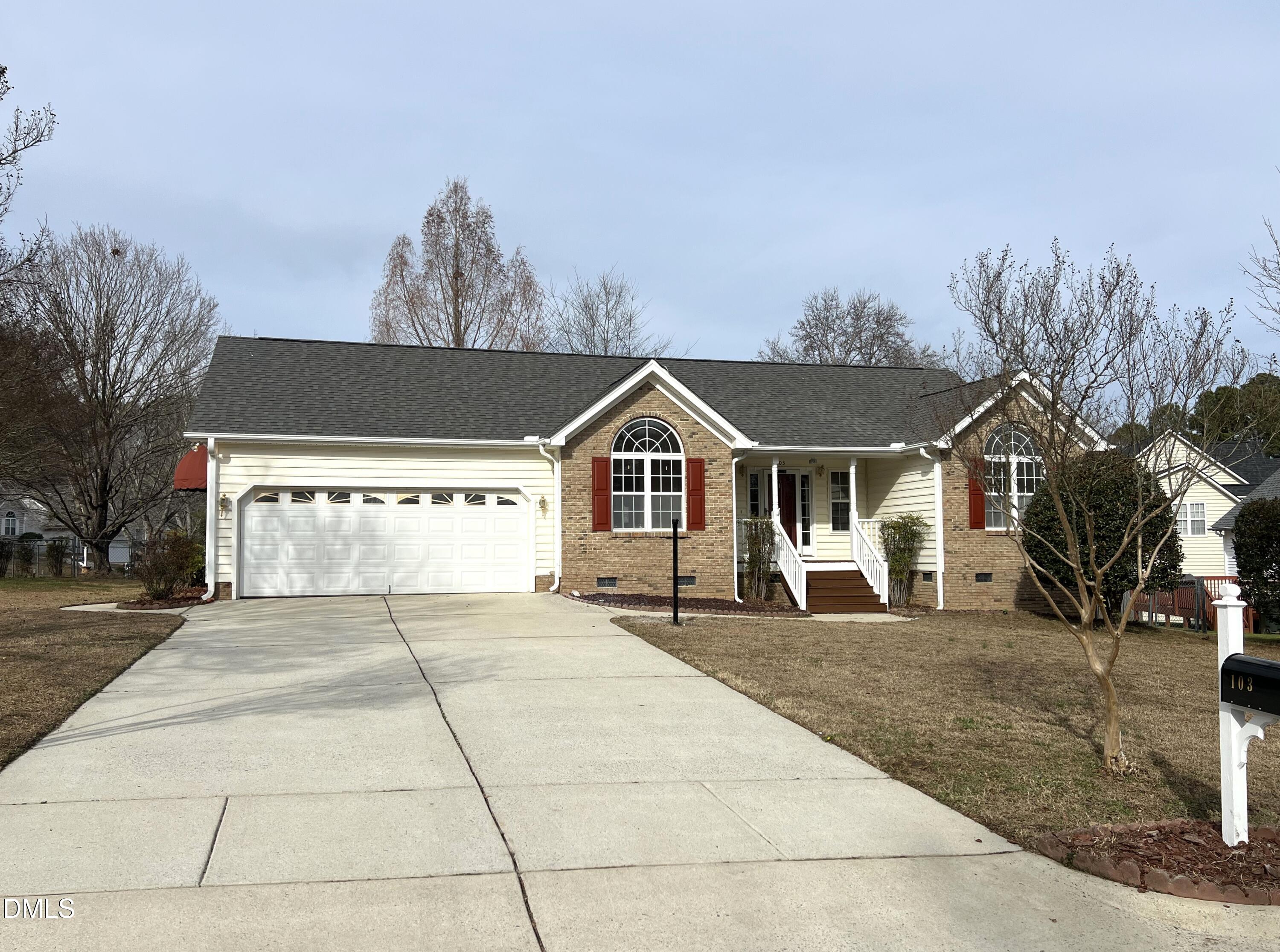 103 Brims Way Garner, NC 27529 - Photo 36 of 36 a front view of a house with a yard and garage