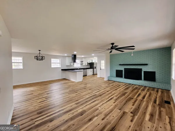 a bedroom with a bed and a fireplace