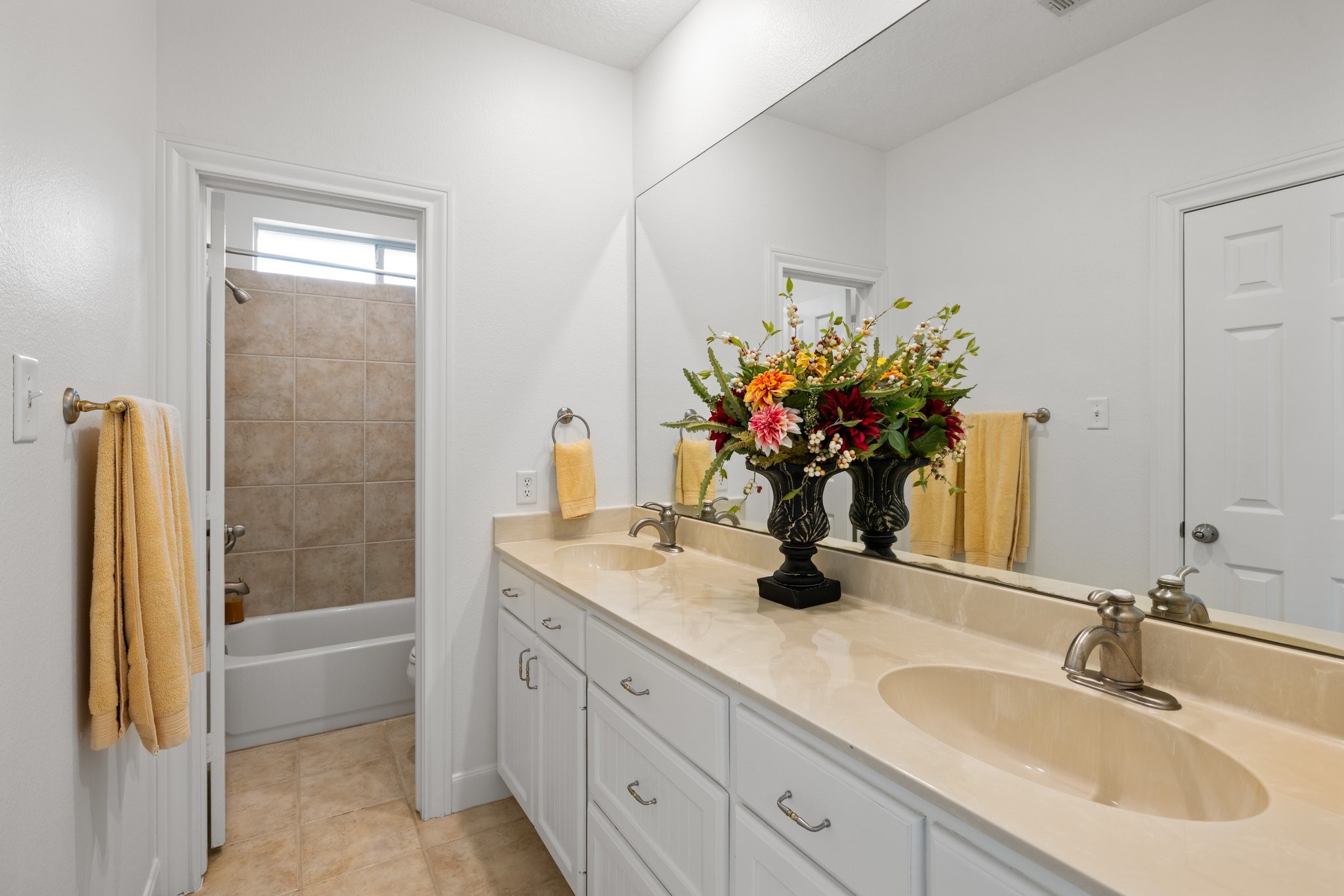 34310 High Point Drive Magnolia, TX 77355 - Photo 19 of 48 Generous ensuite bath enhances the secondary bedroom. Complete with double sinks, plenty of counters space and cabinets for storage.