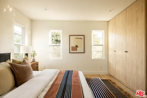 a bed room with a bed and a window